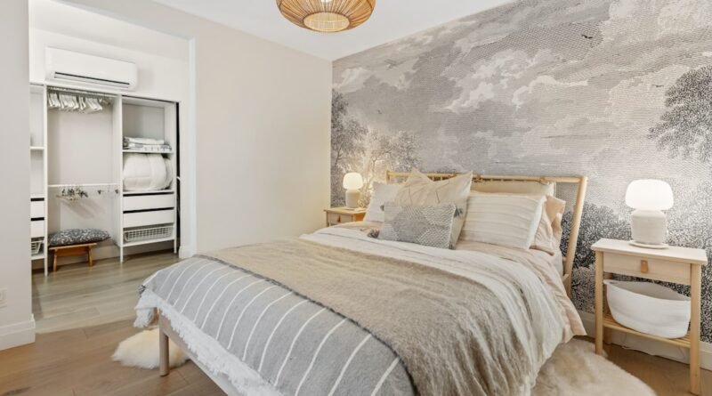 Cozy bedroom with soft neutral gray and white bedding