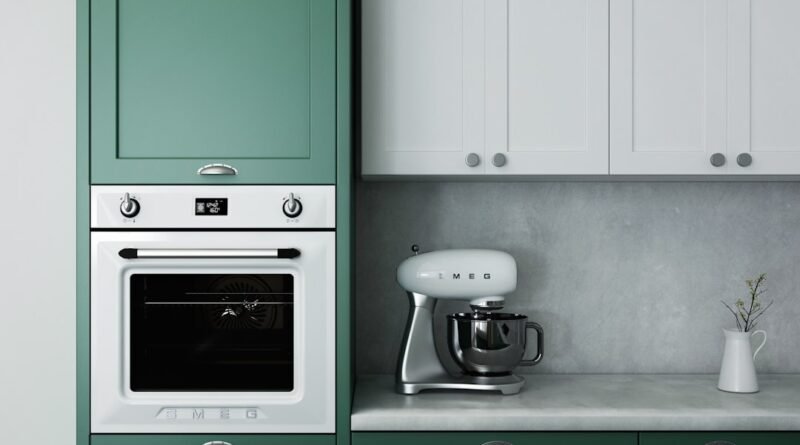 Olive green kitchen cabinets with white countertops and warm wood accents