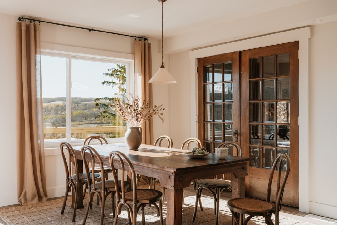 Warm autumn color palette in a wood dining room with a set table