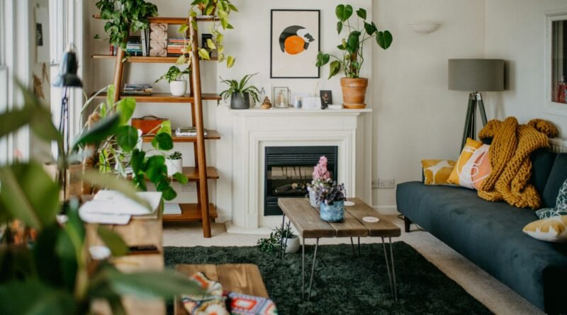 Cozy living room showing a warm autumn color palette with a fireplace and neutral walls