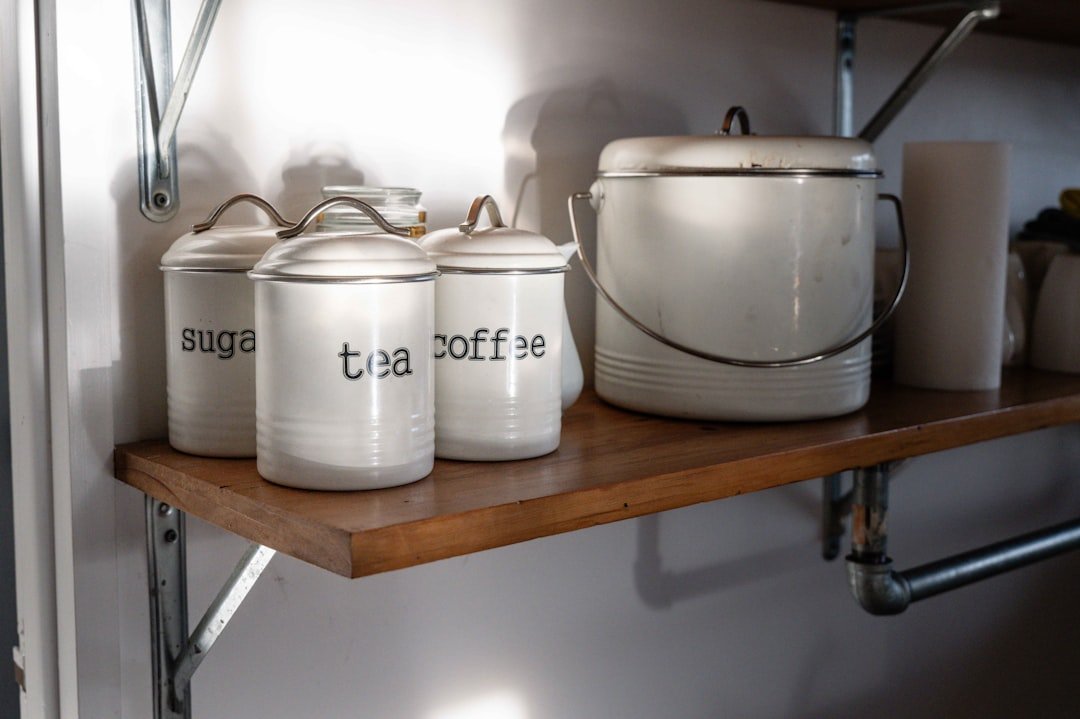Labeled pantry canisters for sugar, tea and coffee as a simple pantry organization system