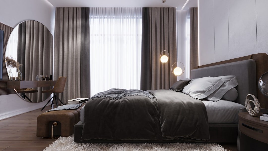 Large mirror reflecting daylight in a small bedroom, a visual trick that makes small bedroom ideas feel roomier