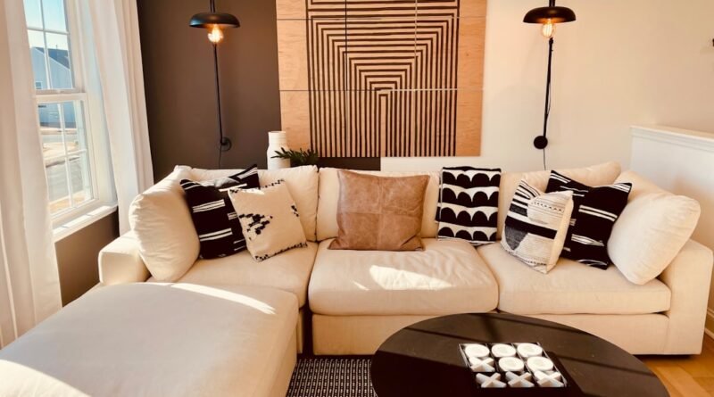 Warm modern living room with layered lighting, sofa, coffee table and multiple light sources