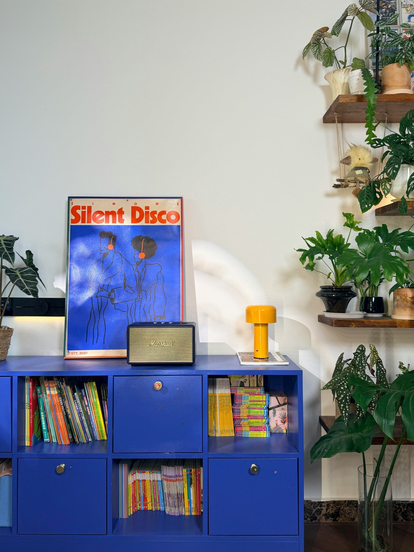 Blue painted cabinet and open shelving, a renter friendly navy accent idea