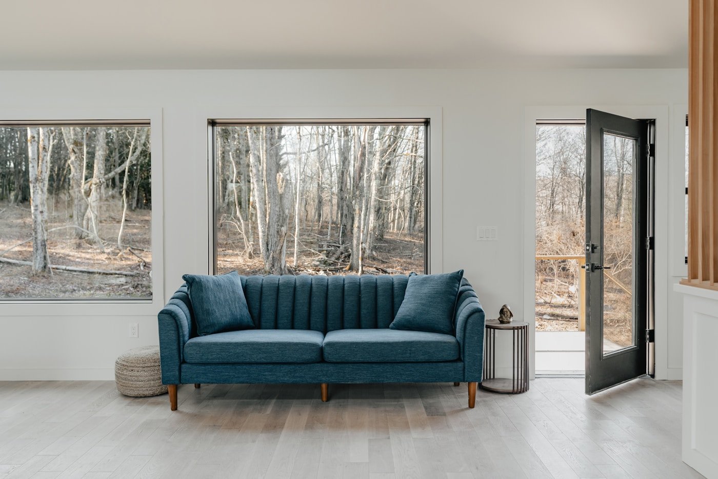 Blue couch as the statement seating in a navy living room