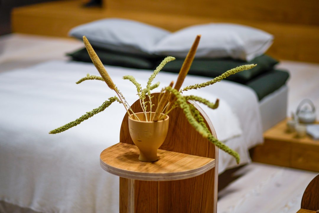 Earthy olive-toned bedroom with warm wood accents