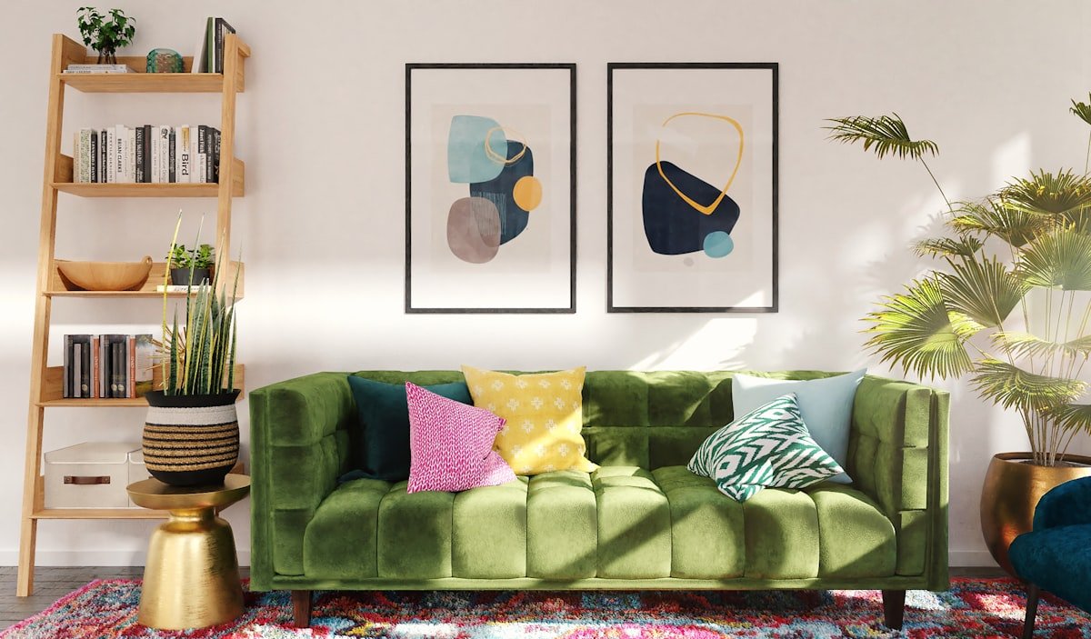 Olive green sofa with green and cream cushions in a bright living room