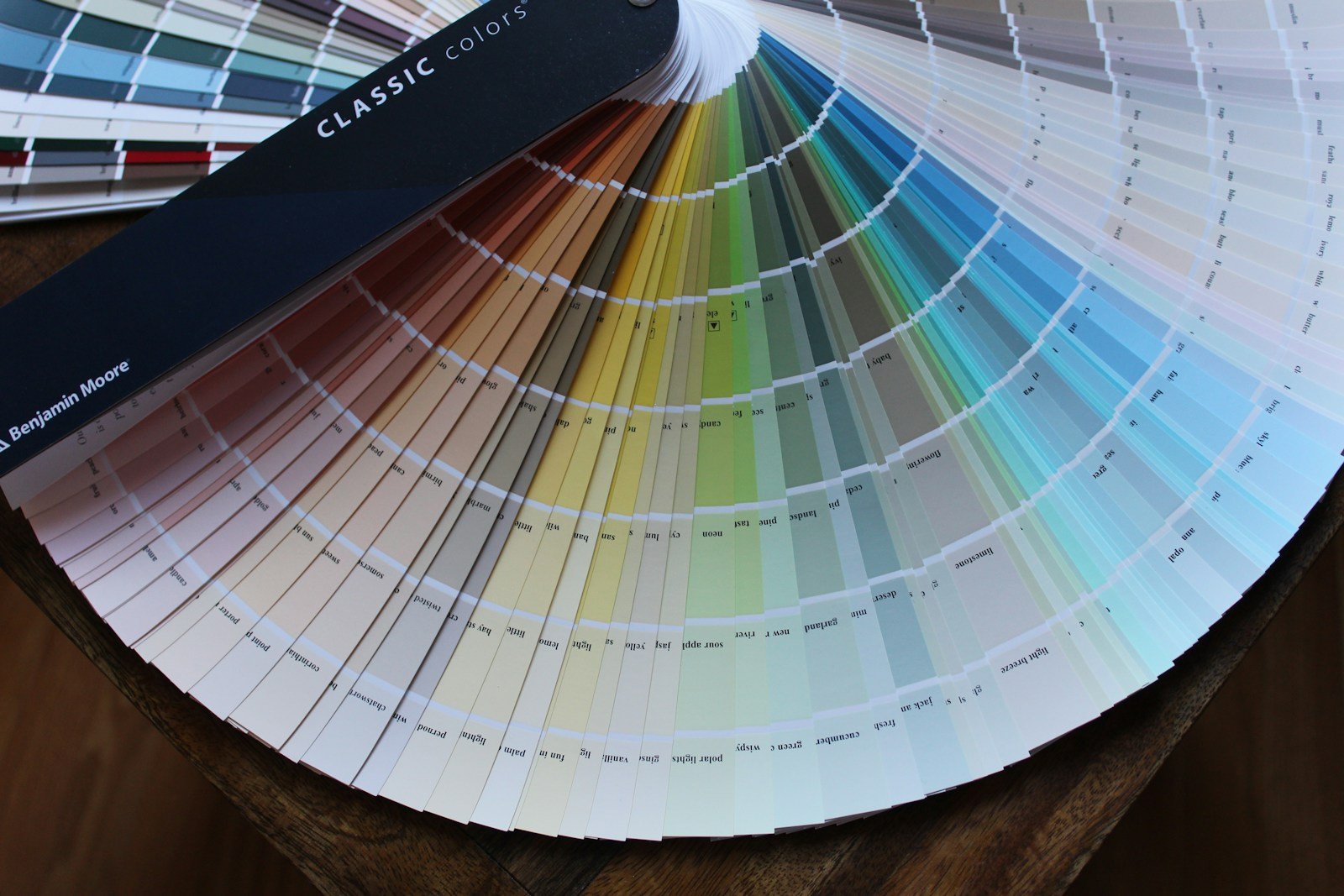 Paint fan deck of neutral swatches used to choose a living room wall color