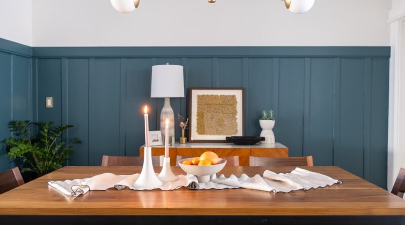 Elegant dining room with classic wall paneling and a warm neutral palette