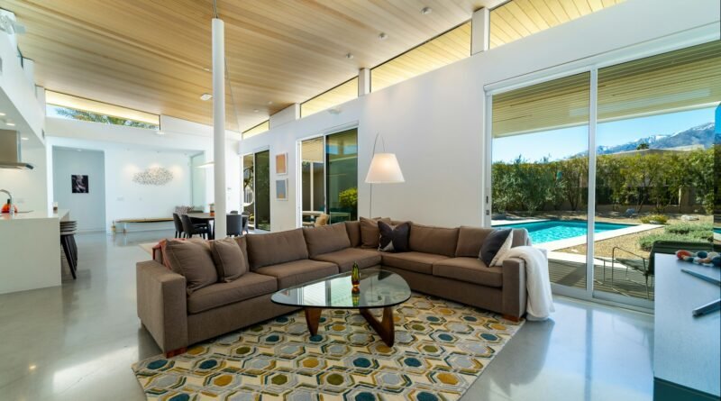Bright living room with a large patterned area rug, sofa and coffee table