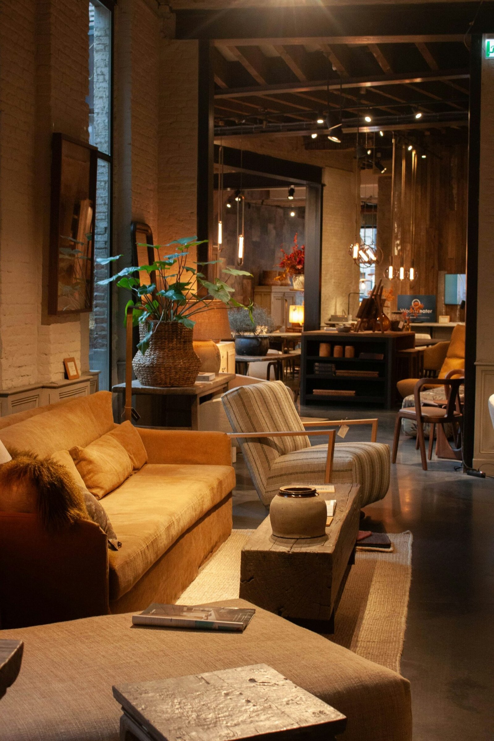 Warm modern living room with a large area rug, sofa, armchair and coffee table